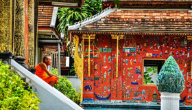 Monk Wat Xieng Thong - Immerse in Laos’ golden Buddhist heritage
